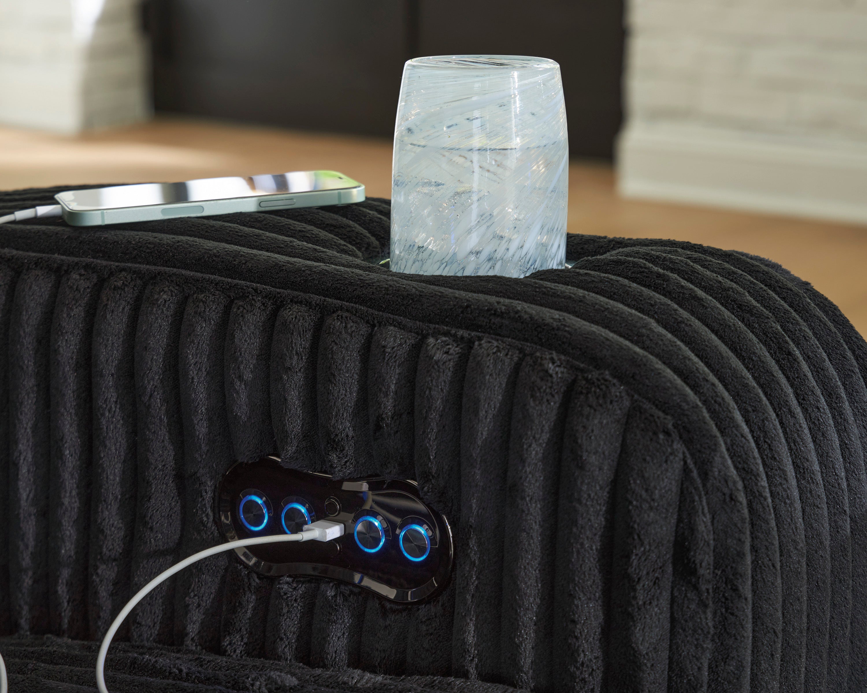 TwinBrooke Power Reclining Black Loveseat with Console and Adjustable Headrest